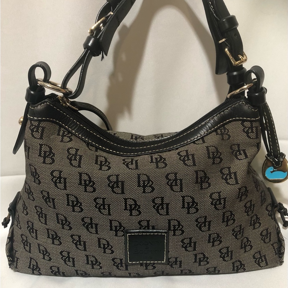 Dooney & Bourke vintage black monogram, blue duck charm.